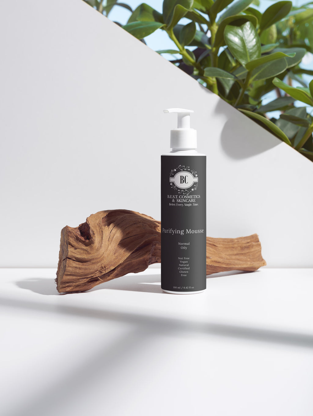 Bottle of 'Best Cosmetics' skincare product on a white surface with natural elements