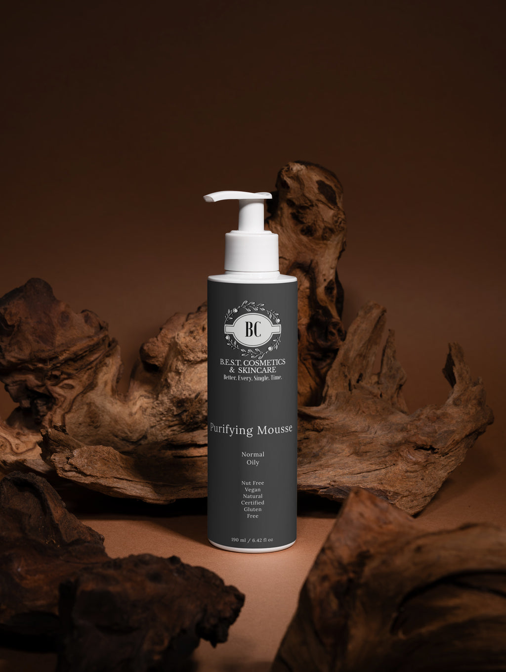 Bottle of 'BC' brand purifying mousse on a brown background with natural elements.